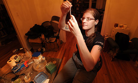 Meredith Patterson works in her lab at her home. Picture credits: The Guardian, UK